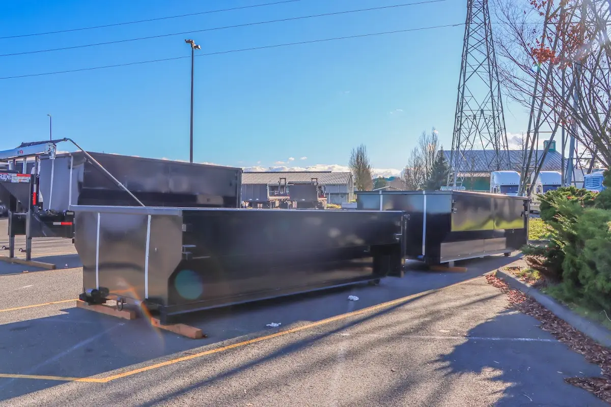 Roll-off dumpster ready for waste disposal at job site for 8 Yard Dumpster Rental in Greenwood